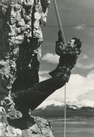 Thumbnail for 'A belayed mountain climber stops on a sheer cliff face, circa late 1930s.'