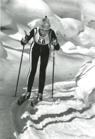 Thumbnail for 'A cross country team member competes in front of a background of heavy fresh snow, ca. 1980s'