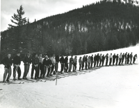 Thumbnail for 'A 1951 alpine ski class poses for a group photograph on Frontier ski course.'