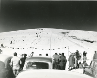 Thumbnail for 'Spectators watch an alpine ski race from the foot of Cupola Hill, ca. early 1950s.'