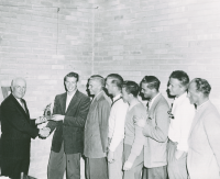 Thumbnail for 'An early-1960s ski team receives a trophy from Paul Wright.'