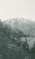 Thumbnail for 'A group of Hiking and Outing Club members on horseback in an alpine valley, 1944.'