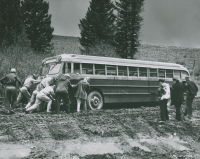 Thumbnail for 'Members of the WSC Hiking and Outing Club attempt to get their excursion bus out of the Washington Gulch mud, 1954.'