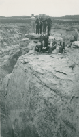 Thumbnail for 'A group of Hiking and Outing Club members pose atop a rock formation, ca. late 1930s.'
