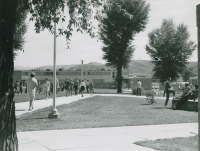 Thumbnail for 'Between classes on Western's campus from the northeast corner of Taylor Hall, circa 1967.  Hurst Hall is in the background.'