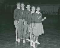 Thumbnail for 'The 1954-1955 Western cheerleading squad shows some leg in Mountaineer Gymnasium.'