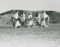 Thumbnail for 'Western cheerleaders pose south of the college, circa mid-1980s.'
