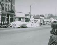Thumbnail for 'The Theta Chi float moves up Main Street during WSC's Homecoming parade, 1958.'