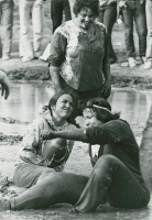 Thumbnail for 'Women's Mud Football Players at Homecoming Festivities, circa 1975'
