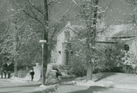 Thumbnail for 'Four Western students walk past the original main entrance to Leslie J. Savage Library after a recent snowfall, circa 1990s.'