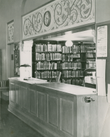 Thumbnail for 'View of the original circulation desk in old Savage Library, circa mid-1950s.'