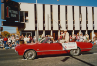 Thumbnail for 'WSC President William Hamilton and Mrs. Hamilton ride up Main Street in the 1987 Homecoming parade.'