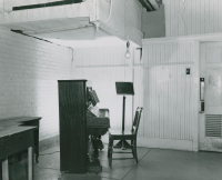 Thumbnail for 'A music practice room in the basement of Taylor Hall, late 1940s.'