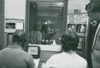 Thumbnail for 'Professor Tom Draper supervises the video control booth during the recording process in Western's television studio, mid-1980s.'