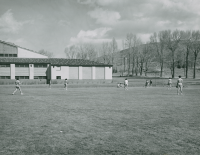 Thumbnail for 'A women's softball class in session just south of the Mountaineer Gymnasium (Wright Gymnasium), circa mid-1950s.'