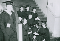 Thumbnail for 'A group of coeds-soon-to-be-graduates sits on the steps in a Taylor Hall stairwell, ca. late 1950s.'