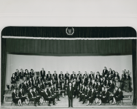 Thumbnail for 'The 1965 WSC Concert Band poses for a photograph in Taylor Hall Auditorium.  Robert Hawkins is the conductor.'