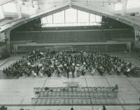 Thumbnail for 'A late-1970s Colorado High School Honors Band and Choir poses for a group photograph in Wright Gymnasium.'