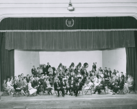 Thumbnail for 'The 1962 Colorado High School Honor Band poses for a photograph in Taylor Hall Auditorium.'