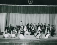 Thumbnail for 'Conductor Robert Marek poses with the 1956 WSC orchestra in Taylor Hall Auditorium.'