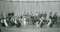 Thumbnail for 'The 1950 WSC orchestra, dressed for a concert, poses for a photograph in Taylor Hall Auditorium.'