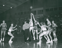 Thumbnail for 'WSC Mountaineers go for the tip off in a game against Regis College, ca. 1956.'