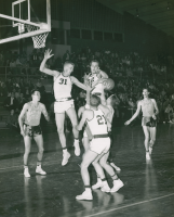 Thumbnail for 'The WSC basketball defense attempts to block a shot by a Wayland Baptist College shooter, 1957.'
