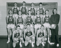 Thumbnail for 'Coach Pete Pederson poses with his 1958-1959 Mountaineer basketball team in Mountaineer Gymnasium.'